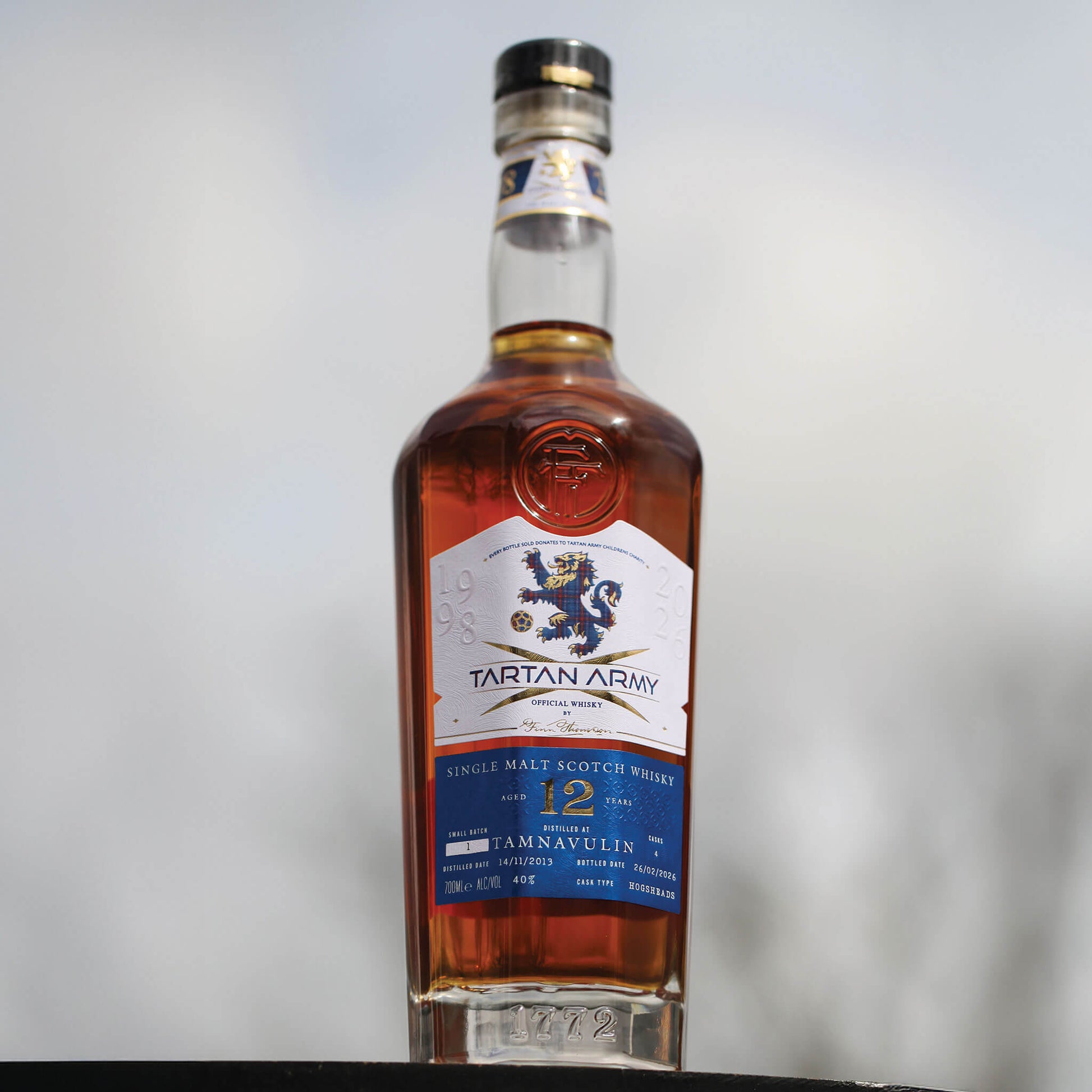 Lifestyle image of a bottle of Tartan Army Tamnavulin Whisky